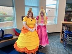 Mrs. Kronthal and Mrs. Chambers dressed up as Princess Daisy and Princess Peach